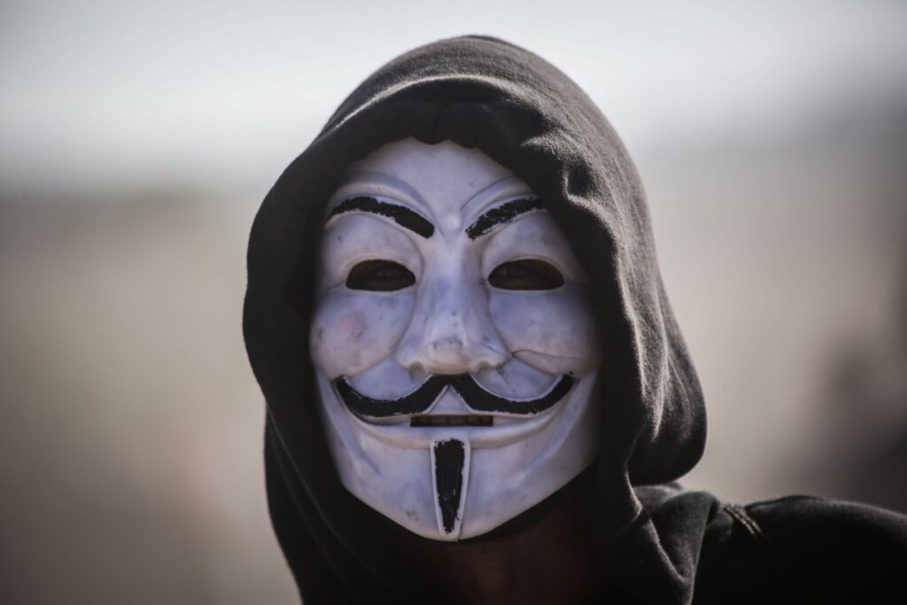 Anonymous mask that is inspired by Guy Fawkes.